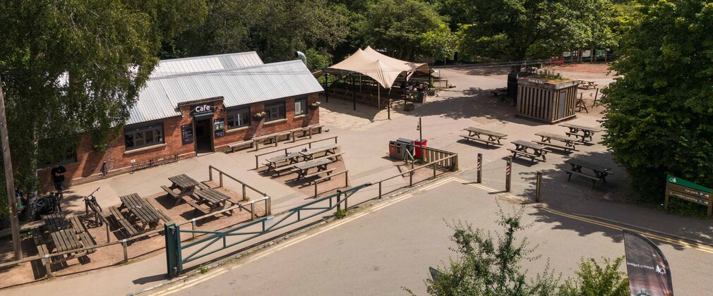 Forest of Dean Cycle Centre's main visitor hub viewed from above, showing the cafe and seating area.