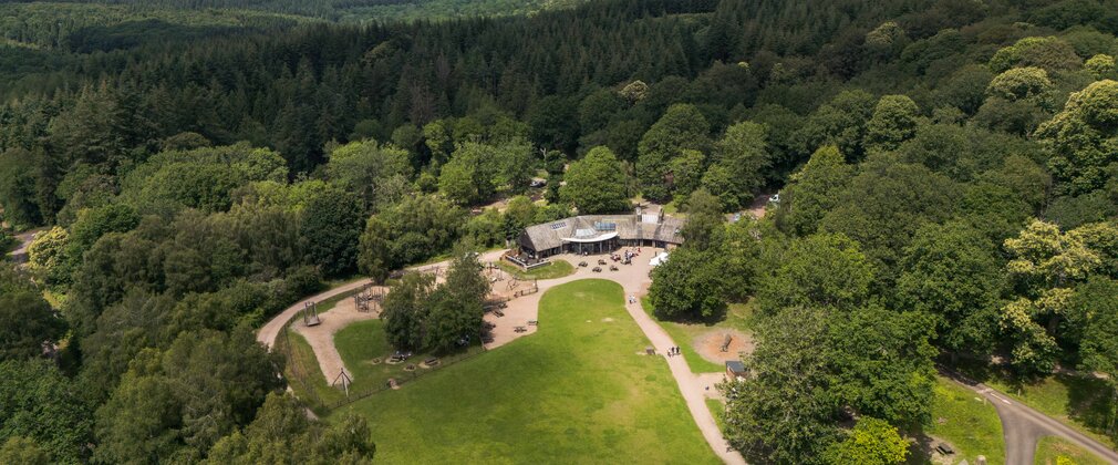 Beechenhurst as viewed from above, showing the main visitor hub nestled within the expansive forest.