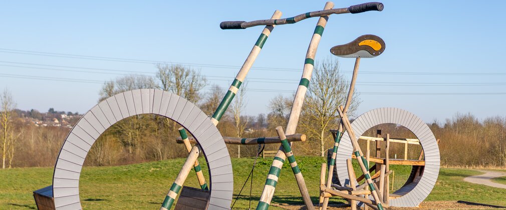 Play equipment in the shape of a bicycle at Hicks Lodge