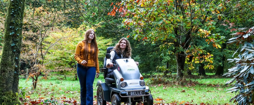 A family enjoying Autumn colours at Cryil Hart Arborteum including Tramper mobility scooter use