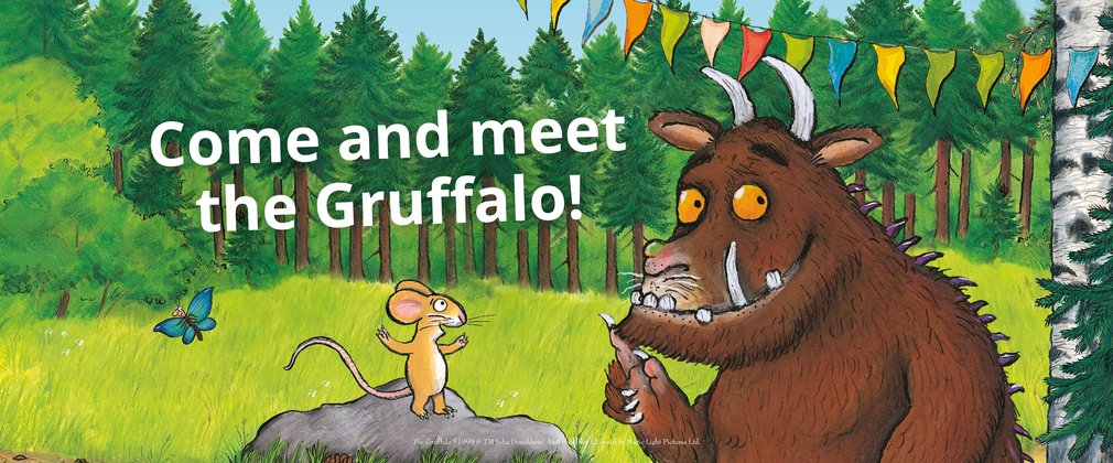 Gruffalo and mouse in the forest with party bunting