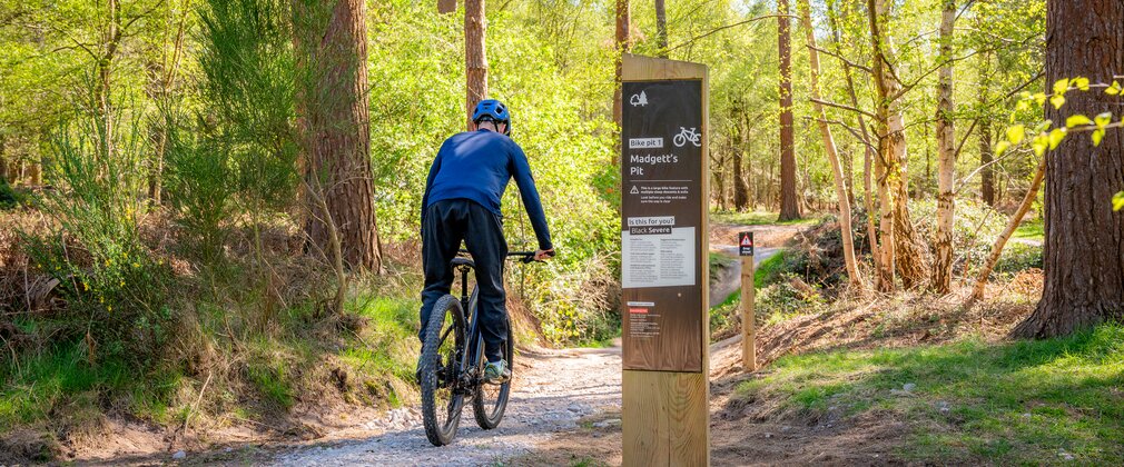 Cyclists rides towards madgetts pit