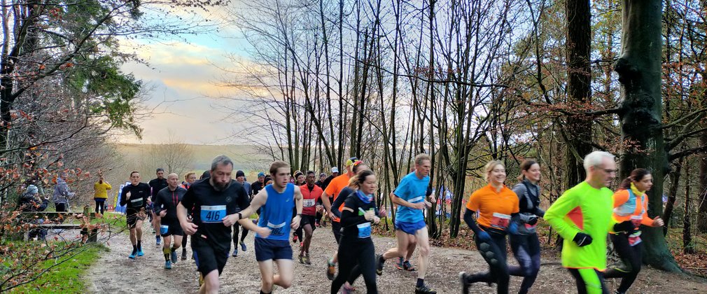 Group of runners leave the start line 