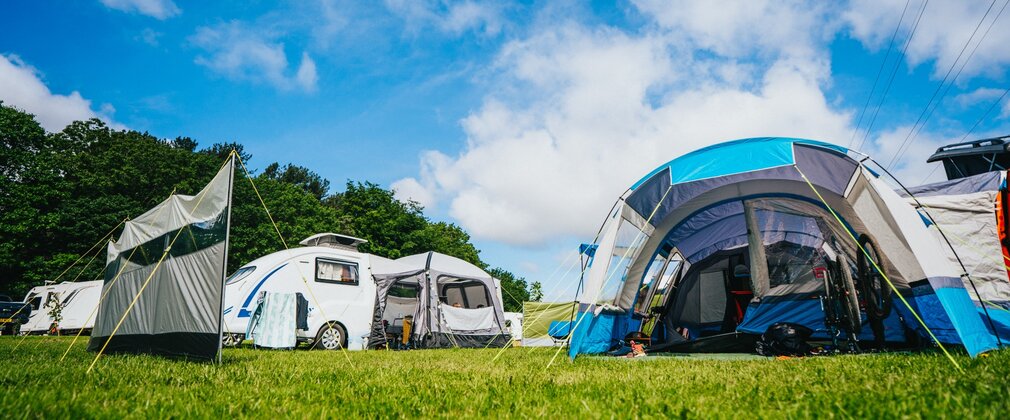 Tents and a campervan at Sherwood Pines Campsite