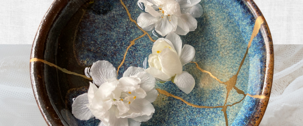 A broken bowl that has been fixed and put back together with gold - the craft of kintsugi