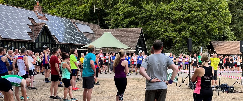 Runners listen to pre event info for high lodge running event