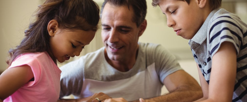 Father and kids using tablet