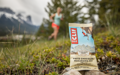 Clif Bars product with runner in a forest