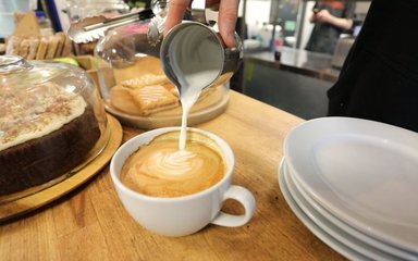 Barista pouring a coffee