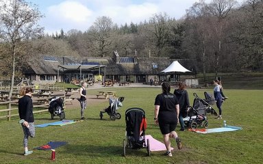 Group of mums exercising with buggies