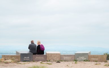 A couple enjoying the view at the top of Haughmond Hill