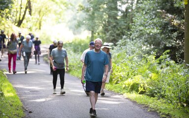 Group of people walking along path
