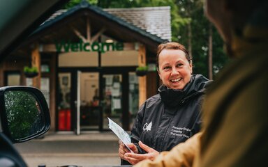 Staff welcoming a campervan at Sherwood Pines Camping