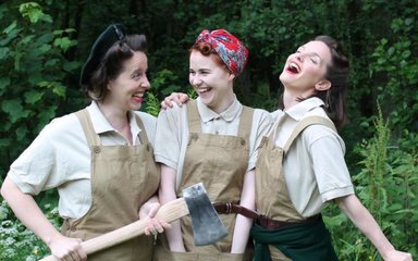 3 actresses dressed as lumberjills
