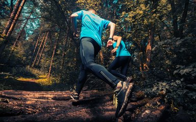 trail runner in forest