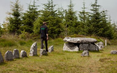 A ranger walking through historic site at Bellever